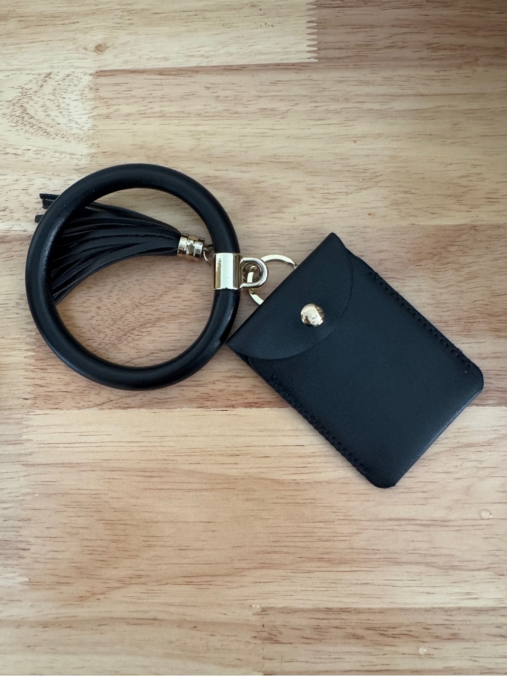 Black bangle wristlet card holder.